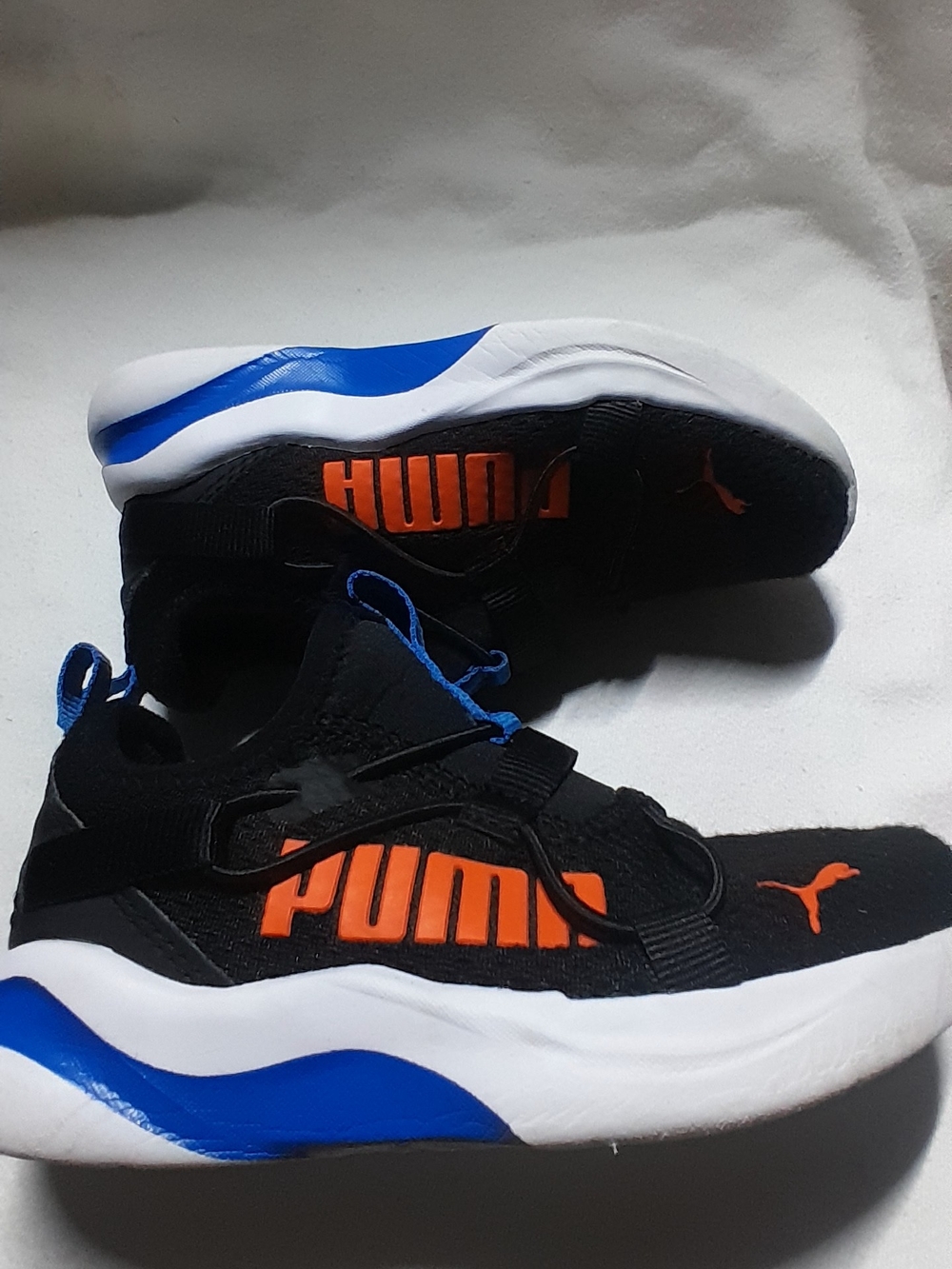 Puma Kids Black Sneakers with Orange Logo and Blue Accents